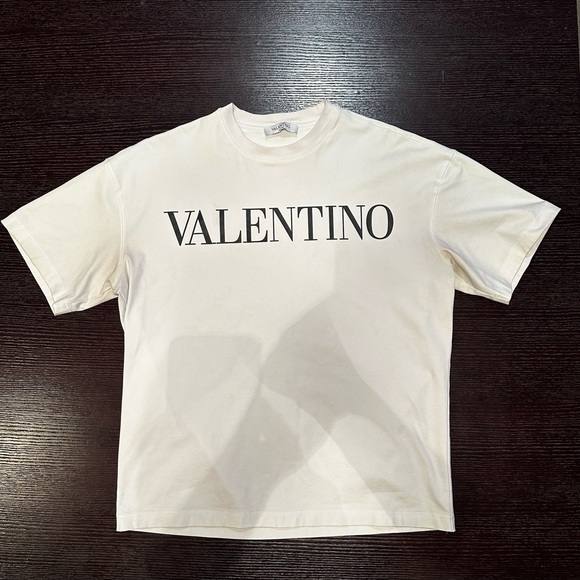 Valentino Men’s white designer tee with black letter insignia logo on front . - Picture 1 of 3